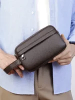 Men’s vintage-style handheld camera and phone storage bag