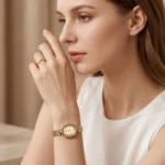 JW oval women's gold-tone quartz watch with chain-style strap