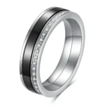 Black and white 5.5 mm ceramic spinner ring with a single row of decorative stones