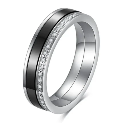 Black and white 5.5 mm ceramic spinner ring with a single row of decorative stones