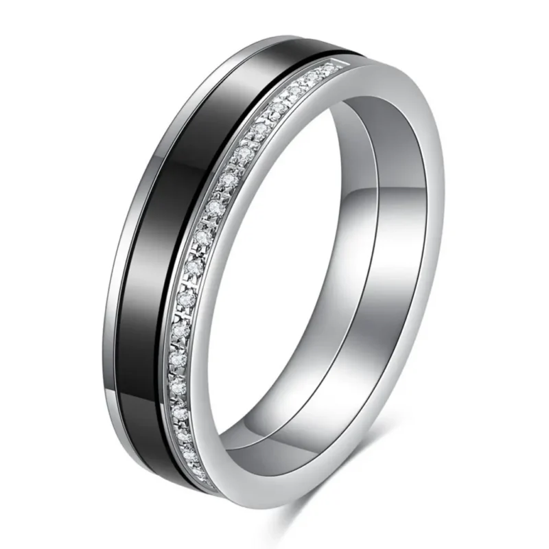 Black and white 5.5 mm ceramic spinner ring with a single row of decorative stones
