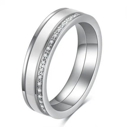 Black and white 5.5 mm ceramic spinner ring with a single row of decorative stones