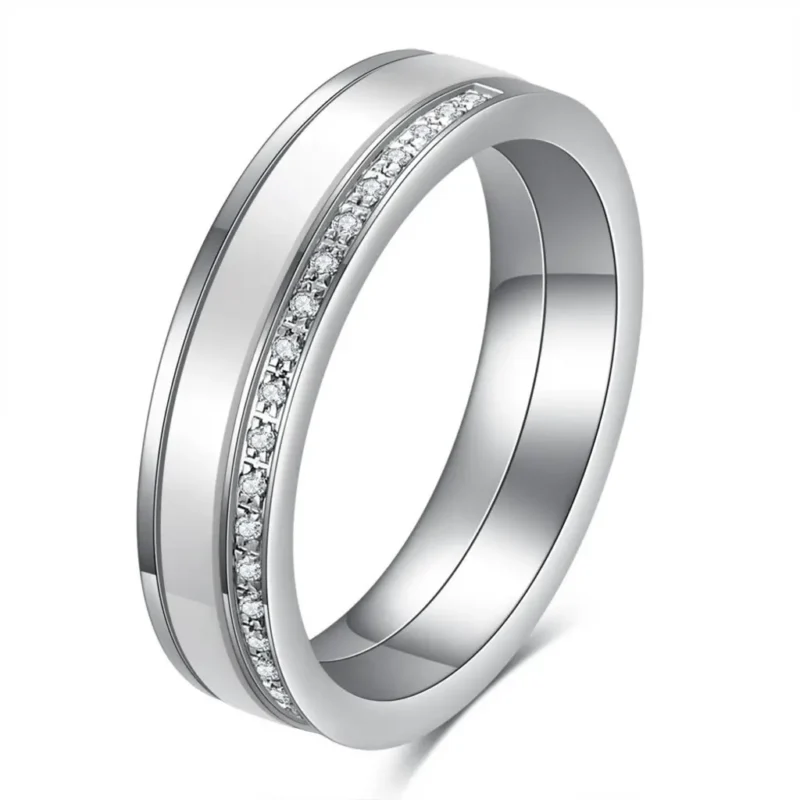 Black and white 5.5 mm ceramic spinner ring with a single row of decorative stones