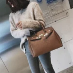 Women's litchi-texture handbag with lock-clasp detail