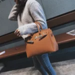 Women's litchi-texture handbag with lock-clasp detail