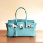 Women's top-grain cowhide handbag with silver buckle